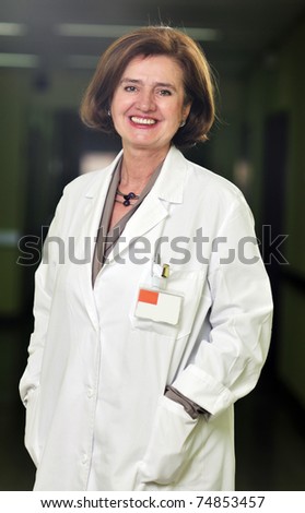 happy  elderly women doctor posing indoor