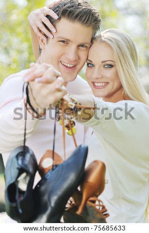 happy young romantic couple in love dance outdoor at spring season on early morning with beautiful light