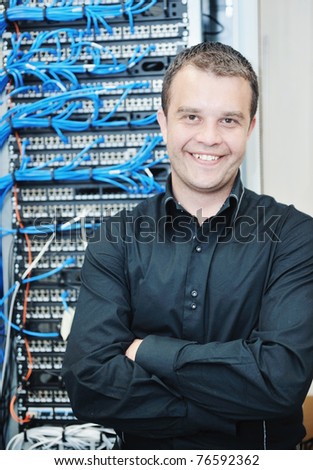 Happy young man indoor server room