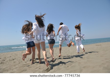 happy people group have fun  run and jump  on beach beautiful sand  beach