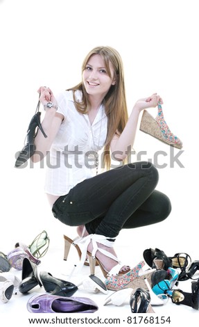pretty young woman with buying shoes addiction, isolated on white background in studio