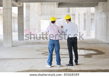 Team of business people in group, architect and engineer  on construction site check documents and business workflow on new building