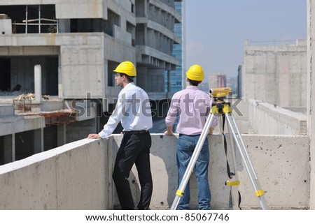 Team of business people in group, architect and engeneer  on construciton site check documents and business workflow on new building