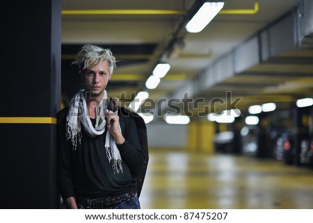 Portrait of an handsome young  man  with urban background and fashion clothes style