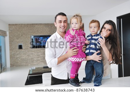 happy young family have fun and relaxing at new home with bright furniture