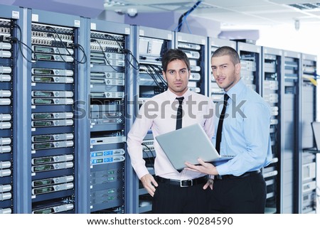 group of young business people it engineer in network server room solving problems and give help and support