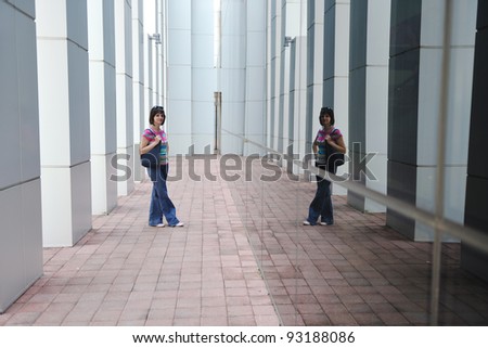 Beautiful woman  outdoor modern city urban street scene with abstract  glass reflections