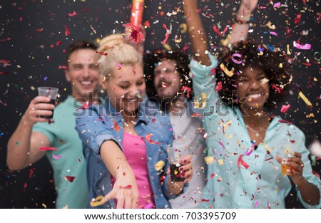 confetti party Multiethnics group of happy young people celebrating new year eve while dancing and have fun at home