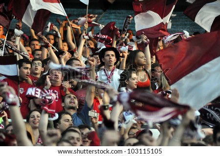 CLUJ NAPOCA, ROMANIA  MAY 20: FC CFR Cluj team happy supporters, after CFR won the Romanian Championship against Steaua Bucharest on May 20, 2012 in Cluj Napoca, Romania