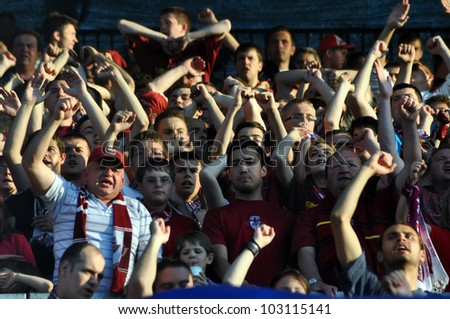 CLUJ NAPOCA, ROMANIA  MAY 20: FC CFR Cluj team happy supporters, after CFR won the Romanian Championship against Steaua Bucharest on May 20, 2012 in Cluj Napoca, Romania