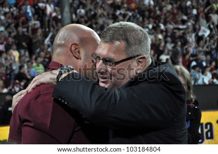 CLUJ NAPOCA, ROMANIA MAY 20: FC CFR Cluj soccer club owner and businees man, Arpad Paszkany (L) and club manager Iuliu Muresan (R) celebrating the league title , on MAY 20, 2012 in Cluj N, Romania