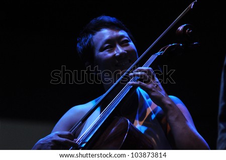 CLUJ NAPOCA, ROMANIA Ã¢Â?Â? MAY 29: Pansy Chang form Pink Martini pop-jazz band performs live on cello at the Sports Hall of Cluj, Romania, MAY 29, 2012 in Cluj-Napoca, Romania