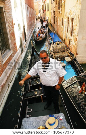 VENICE - AUGUST 29: Unidentified tourists visit the Grand canal. More than 21 million tourists visits Venice annually. On August 29, 2010 in Venice, Italy