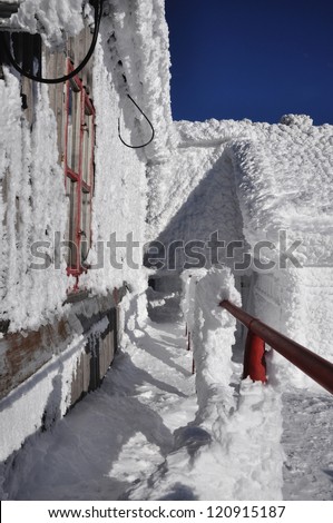 An ice-covered screen weather station, high on a mountain-top at Vladeasa, Romania