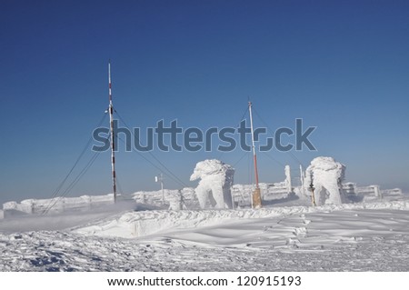 An ice-covered screen weather station, high on a mountain-top at Vladeasa, Romania