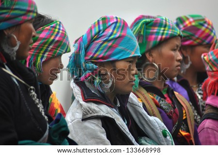 SAPA - FEB 22: Unidentified women sellers of the flower H\'mong indigenous tribe in the local market. H\'mong tribe is one of the minority tribes in Northern Vietnam. On Feb. 22, 2013 in Sapa, Vietnam