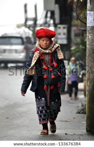 SAPA - FEB 22: Unidentified woman from the Red Dao Ethnic Minority Group. Red Dao They are known for their indigo-dyed costumes and ornate silver jewellery. On Feb. 22, 2013 in Sapa, Vietnam