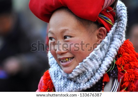 SAPA - FEB 22: Unidentified woman from the Red Dao Minority group with a turban. Red Dao Minority are the 9th largest ethnic group in Vietnam. On Feb. 22, 2013 in Sapa, Vietnam