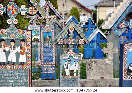 SAPANTA - JULY 21: Carved and painted wooden crosses in the Merry Cemetery, after the renovation. Part of UNESCO is visited by crowds of tourists every year. On July 21, 2013 in Sapanta, Romania