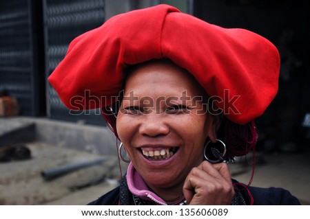 SAPA - FEB 24: Portrait of an unidentified woman from the Red Dao Minority group with a turban. Red Dao Minority are the 9th largest ethnic group in Vietnam. On Feb. 24, 2013 in Sapa, Vietnam