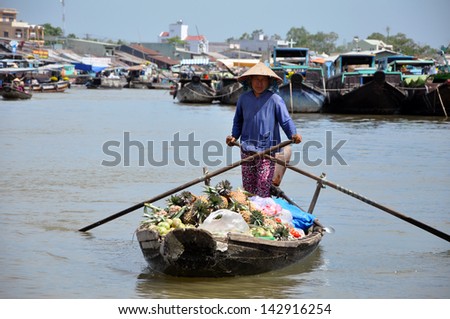 CAN THO - FEB 17: Unidentified seller at the Floating Market. With hundreds of boats, Cai Rang is one of the biggest floating markets in the world. On Feb. 17, 2013, in Can Tho, Mekong Delta, Vietnam
