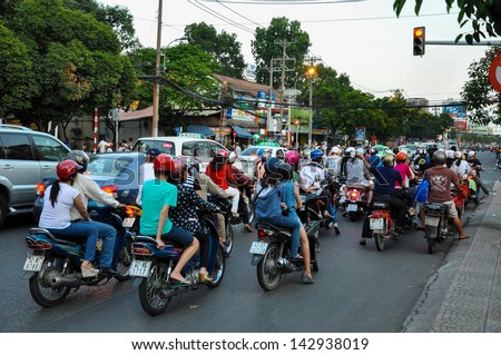HO CHI MINH - FEB15: Chaotic road traffic in Saigon, Vietnam. In the biggest city in Southern Vietnam are more than 4 mil. motorbikes, the traffic is often congested. Feb 15, 2013, Saigon, Vietnam