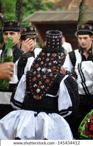 GHERTA MICA, ROMANIA - JULY 12: Unidentified bride in traditional dress celebrate a traditional Romanian wedding on JULY 12, 2012, in Gherta Mica, Maramures, Romania