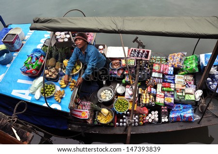 HA LONG BAY - FEB 27: Unidentified merchant selling goods in Halong bay. Halong Bay is one of the most popular tourist destinations of Asia. On February 27, 2013 in Ha Long Bay, Vietnam