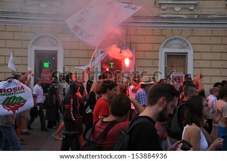 CLUJ - SEPT 1: People join a protest against the Romanian Government that passed a law allowing the gold extraction project at Rosia Montana against the people\'s will. On Sept 1, 2013 in Cluj, Romania
