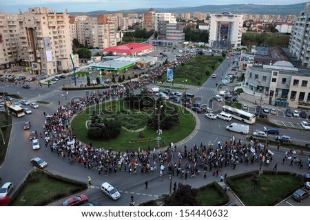 CLUJ - SEPT 15: People join a protest against the Romanian Government that passed a law allowing the gold extraction project at Rosia Montana against the people\'s will. Sept 15, 2013 in Cluj, Romania