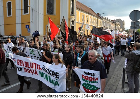 CLUJ - SEPT 15: People join a protest against the Romanian Government that passed a law allowing the gold extraction project at Rosia Montana against the people\'s will. Sept 15, 2013 in Cluj, Romania