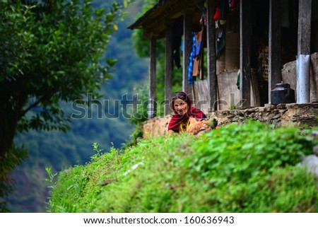 LANDRUK, NEPAL - OCTOBER 1: Portrait of a Gurung woman in the mountains. Gurungs are the biggest ethnic group in the Himalayas. On October 1, 2013 in Landruk, Nepal
