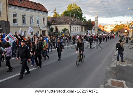 CLUJ - SEPT 22: People of Cluj protest against the corrupt Romanian Government for supporting the open pit cyanide gold mining project in Rosia Montana. On Sept 22, 2013 in Cluj, Romania