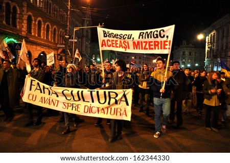 CLUJ - NOV 10: Environmental and social activists protest against the corrupt Romanian Government that supporting the open pit cyanide gold mining project in Rosia Montana. Nov, 2013 in Cluj, Romania