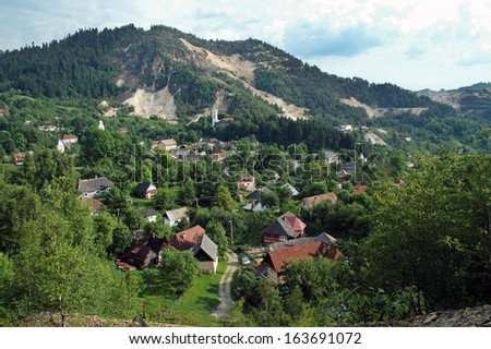 Open pit gold mining destroying Rosia Montana village. Romania