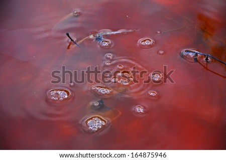 Red toxic contaminated water from a copper mine in Geamana, Romania