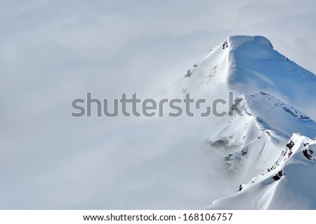 Beautiful winter mountains covered with snow in a sunny day