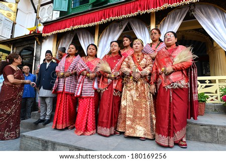 KATHMANDU - OCT 11:  The Queen and the  Royal ladies of Nepal, gathered in the Royal Palace to celebrate the first day of the Dashain festival. On October 11, 2013 in Kathmandu, Nepal