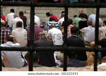 SARAJEVO - AUGUST 7: Muslim men sit down during their daily praying in the central mosque in Sarajevo. On August 7, 2009 in Sarajevo, Bosnia and Herzegovina.