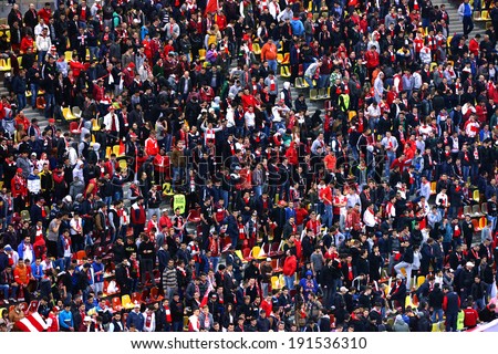 BUCHAREST - APRIL 17: Crowd of football supporters during a match between Dinamo and Steaua Bucharest. On April 17, 2014 in Bucharest, Romania
