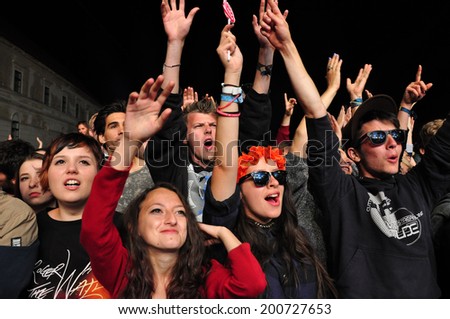 BONTIDA - JUNE 22: Crowd of partying people during a live concert at Electric Castle Festival on June 22, 2014 in the Banffy castle in Bontida, Romania