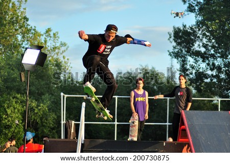 BONTIDA - JUNE 19: Unidentified skateboarder doing a slide trick during the Skateboard Competition at Electric Castle Festival on June 19, 2014 in the Banffy castle in Bontida, Romania