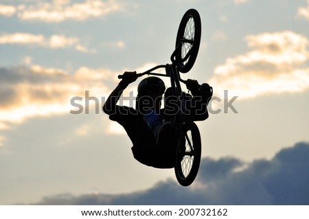 BONTIDA - JUNE 19: Unidentified BMX rider making a bike jump during the BMX Competition, at Electric Castle Festival on June 19, 2014 in the Banffy castle in Bontida, Romania