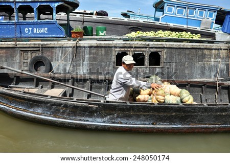 CAN THO - FEB 17: Unidentified fruit seller at the Floating Market. With hundreds of boats, Cai Rang is the biggest floating market in the Mekong Delta. On Feb. 17, 2013, in Can Tho, Vietnam