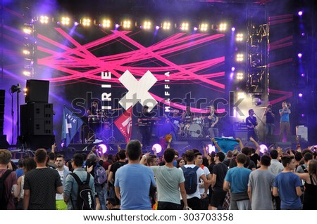 CLUJ NAPOCA, ROMANIA - AUGUST 2, 2015: Crowd of partying people enjoy a Irish Maffia live concert at the Untold Festival