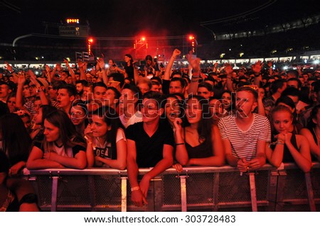 CLUJ NAPOCA, ROMANIA - JULY 30, 2015: Crowd of cheerful young people having fun  during a live concert at Untold Festival in the European Youth Capital city of Cluj Napoca