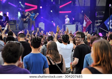 CLUJ NAPOCA, ROMANIA - AUGUST 2, 2015: Crowd of cheerful people having fun during an Irish Maffia concert at Untold Festival