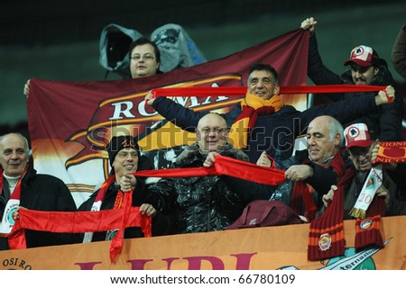 CLUJ, ROMANIA - DECEMBER 7: Italian fans of AS Roma during the official training of AS Roma before UEFA Champions League game against CFR 1907 Cluj on DECEMBER 7, 2010 in Cluj-Napoca, Romania
