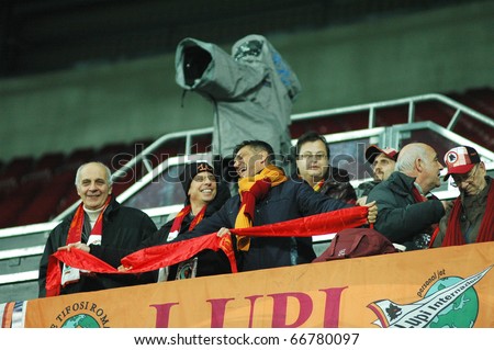 CLUJ, ROMANIA - DECEMBER 7: Italian fans of AS Roma during the official training of AS Roma before UEFA Champions League game against CFR 1907 Cluj on DECEMBER 7, 2010 in Cluj-Napoca, Romania