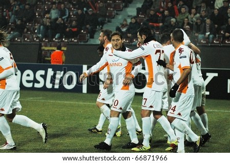 CLUJ NAPOCA, ROMANIA - DECEMBER 8: AS Roma players celebrate a goal at a Champions League soccer game CFR 1907 Cluj vs AS Roma on December 8, 2010 in Cluj Napoca, Romania